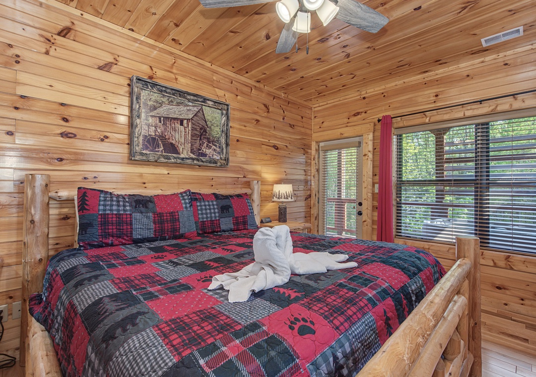 Sink into your cozy log cabin retreat with rustic charm, plaid bedding, and towel swans welcoming you home.