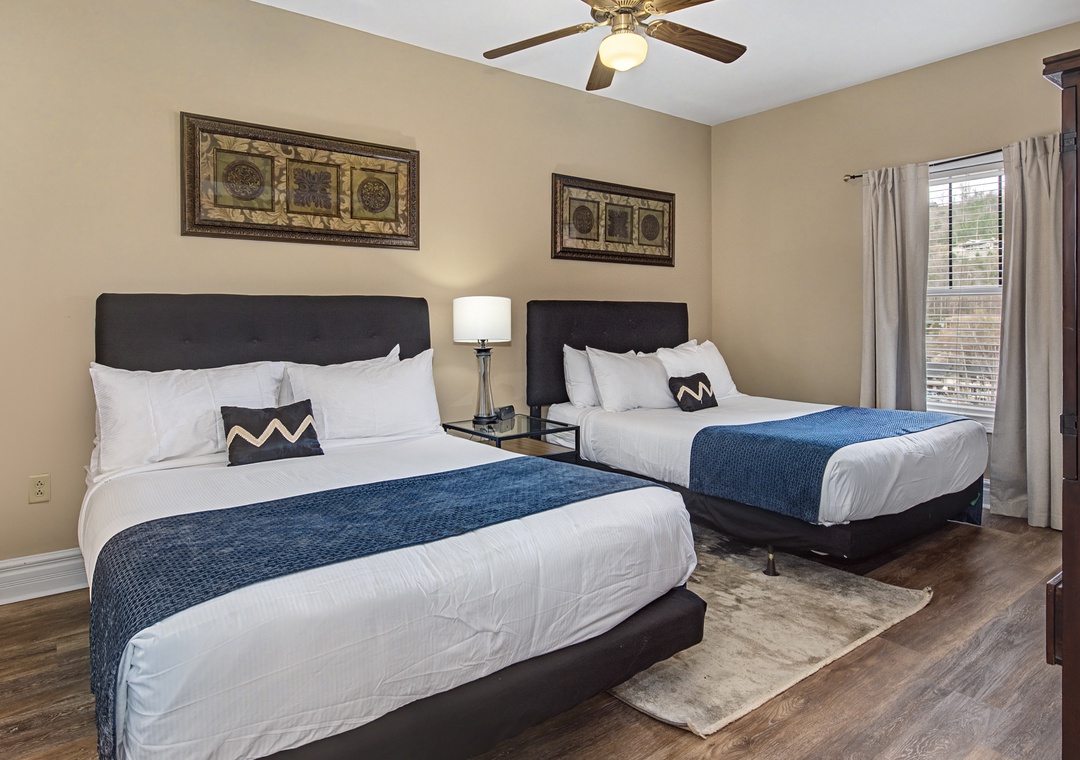 Sink into comfort in your elegant guest bedroom with twin beds dressed in crisp linens and soothing blue accents.