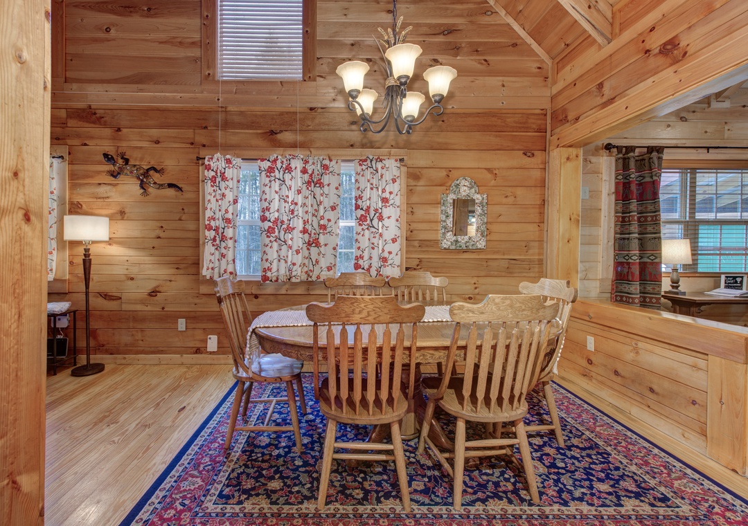 Gather around this handcrafted wooden dining table where your family meals become cherished memories in this warm, rustic cabin setting.