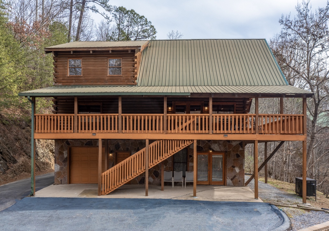 A charming log cabin nestled in the woods with spacious covered deck and convenient ground-level parking for your mountain getaway.