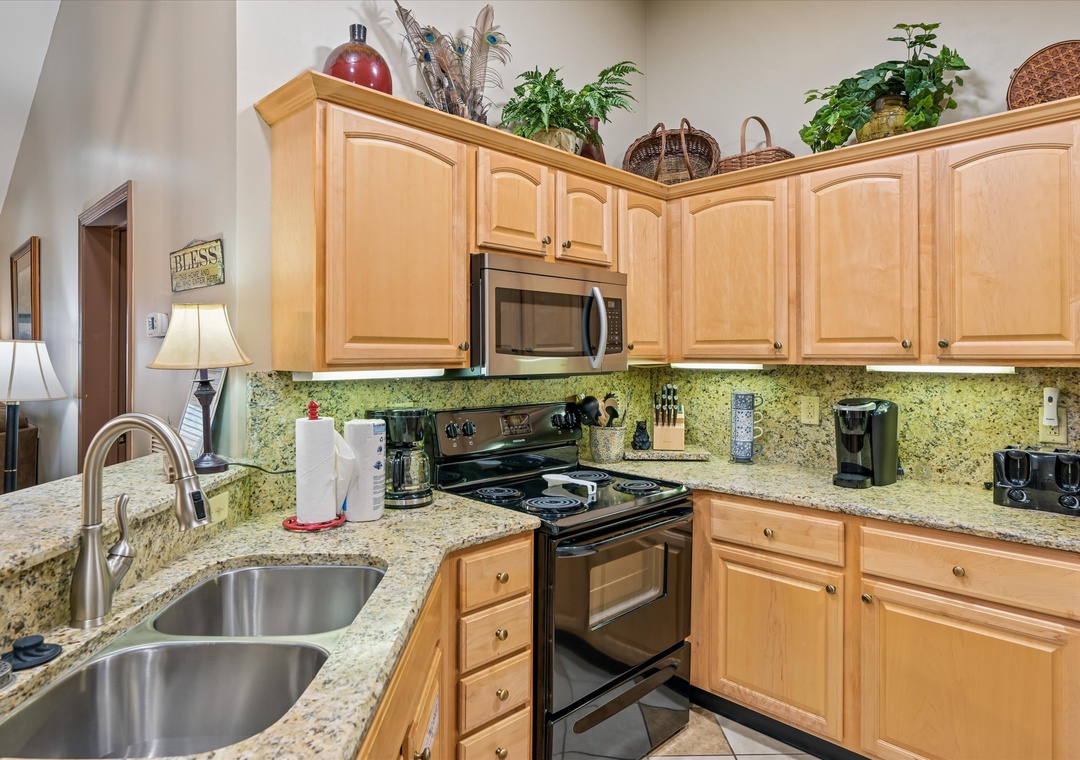 Your fully equipped kitchen features granite counters, stainless appliances, and charming touches that make cooking feel like home.