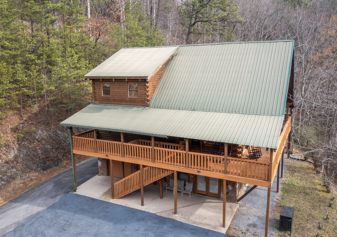 A stunning log cabin retreat nestled in nature, featuring multi-level decks and spacious parking for your mountain getaway.