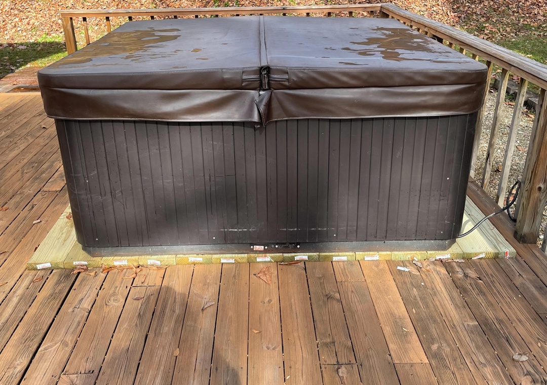 Soak your worries away in this private hot tub on your secluded deck, surrounded by peaceful nature.