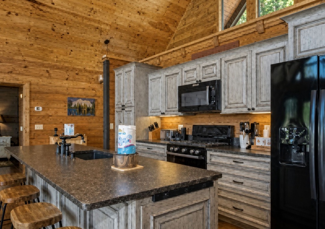 Cook memorable meals in your spacious cabin kitchen, where rustic wood beams meet modern appliances under soaring ceilings.