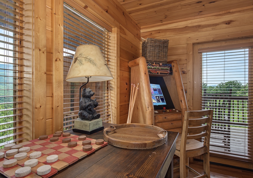Settle into this cozy cabin corner where rustic charm meets playful moments. Challenge your travel companions to a game of checkers or browse magazines as natural light filters through the blinds.