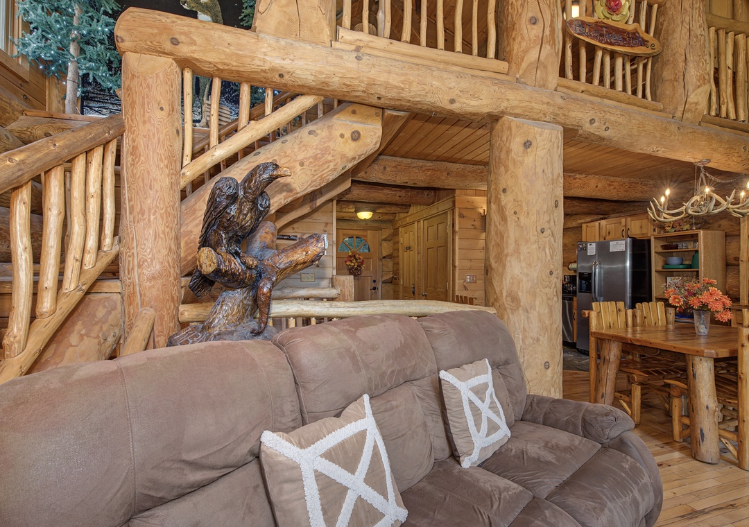 Step into a handcrafted log cabin where every detail invites you to unwind. Soaring timber beams, rustic accents, and cozy furnishings create your mountain retreat.