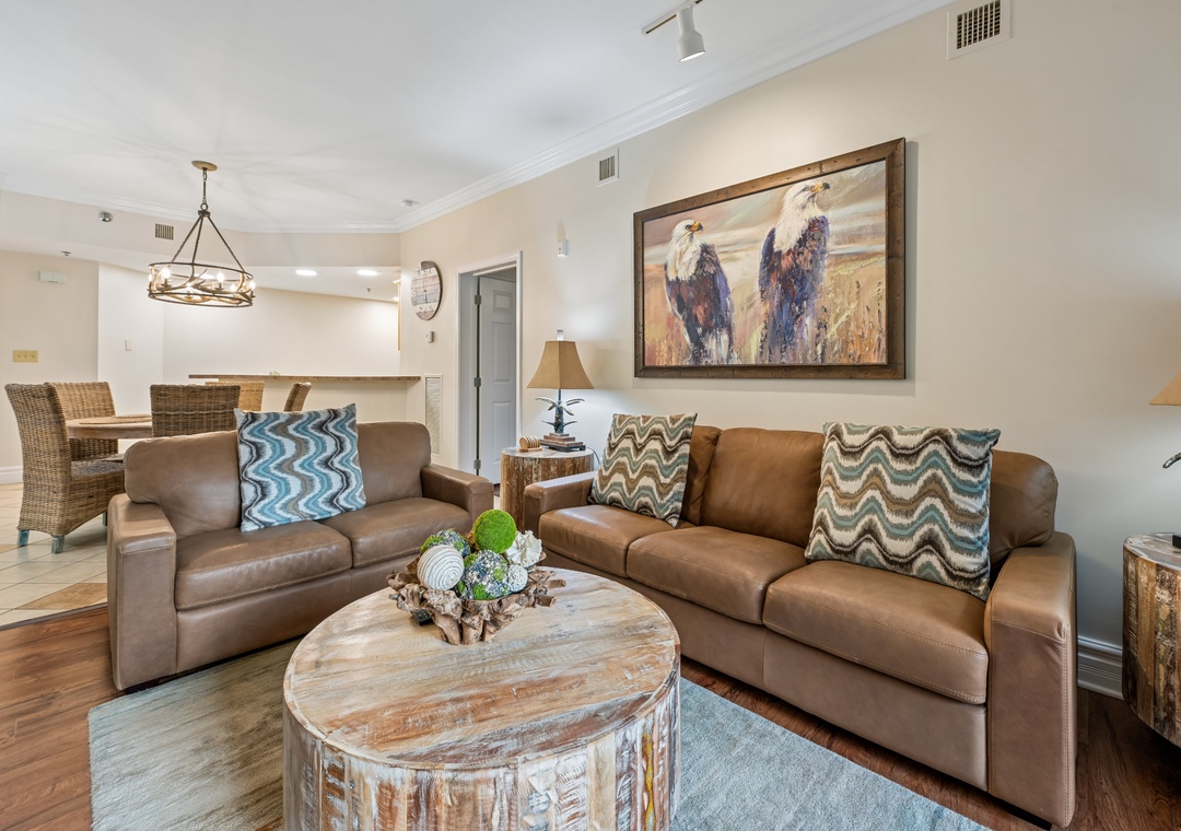 Sink into plush leather sofas in your open-plan living space, where warm western artwork and rustic wood accents create the perfect backdrop for your relaxing getaway.