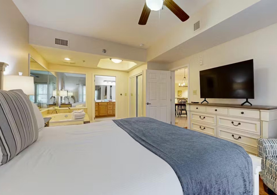 Unwind in your spacious master suite featuring a plush king bed, entertainment center, and luxurious en-suite bathroom with soaking tub.