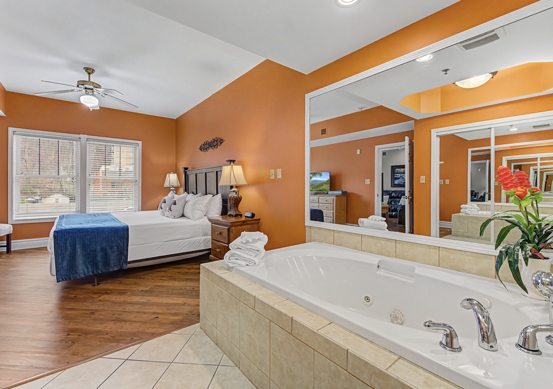 Unwind in your luxurious suite featuring a romantic jetted tub and plush king bed, perfect for an intimate getaway.