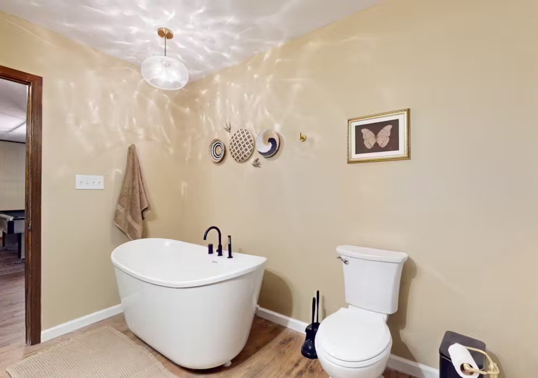 Unwind in your private spa-like bathroom with a luxurious soaking tub, perfect for melting away stress after exploring.