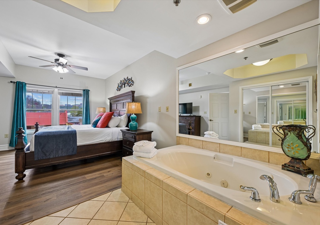 Unwind in your romantic suite featuring a luxurious jetted tub and elegant bedroom - perfect for your romantic getaway retreat.