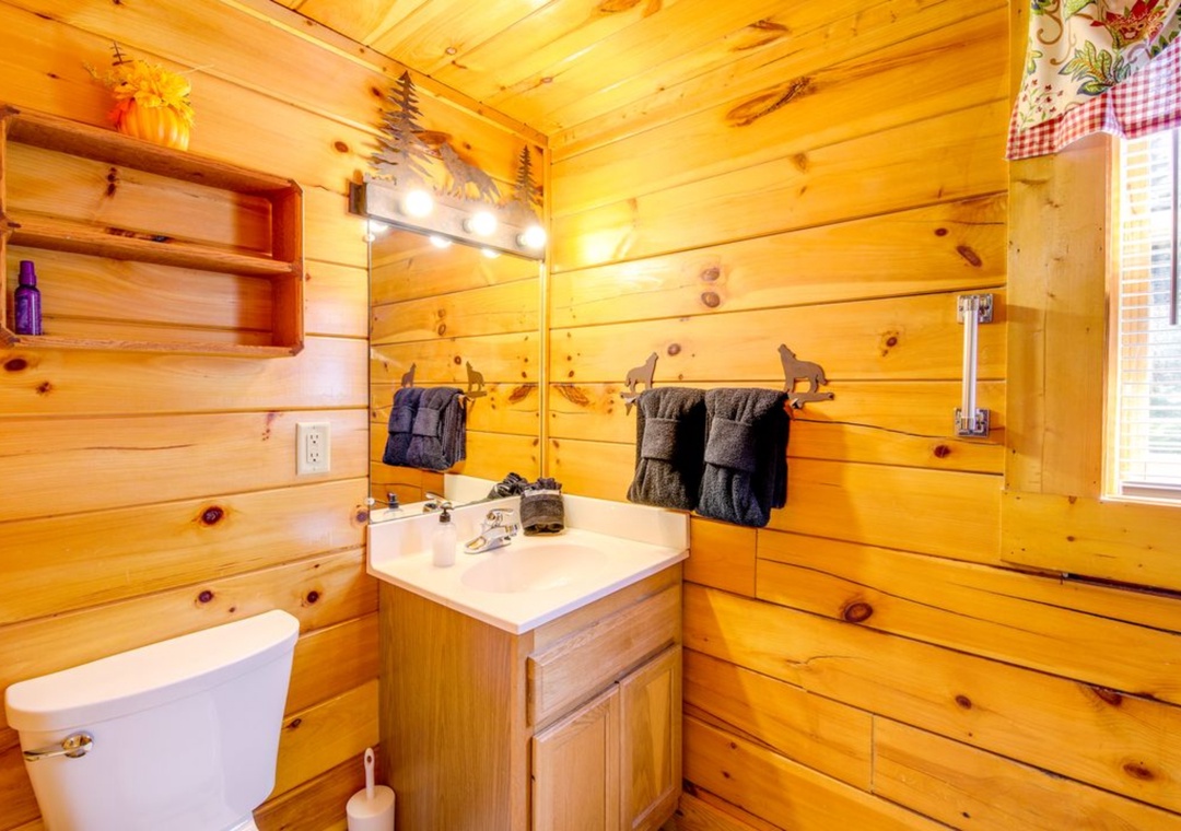 Step into your rustic log bathroom, where warm wood walls and cozy charm make your morning routine feel like a cabin retreat.