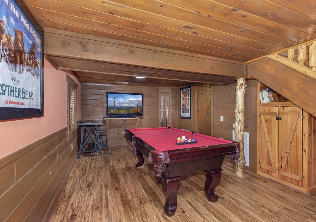 Challenge friends to pool games in your private recreation room featuring rustic wood beams and mountain lodge charm.