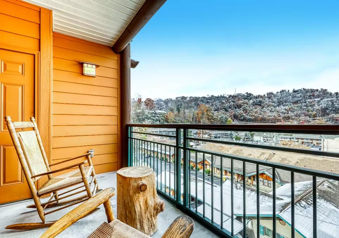 Unwind on your private balcony with rustic mountain charm and sweeping hillside views for peaceful moments.