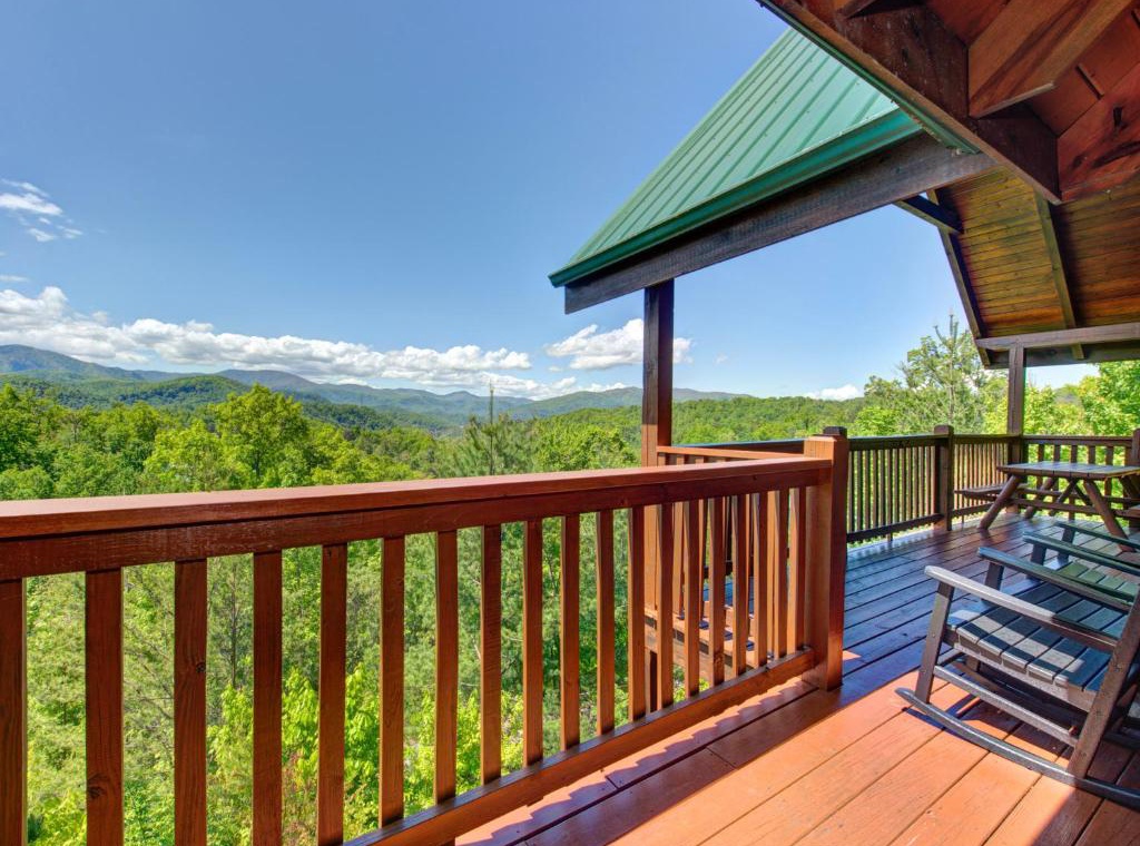 Unwind on your private deck with breathtaking mountain views stretching to the horizon, where comfortable seating awaits your morning coffee or evening relaxation.