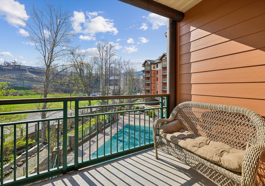 Relax on your private balcony overlooking the pool and scenic mountains—perfect for morning coffee or evening unwinding.