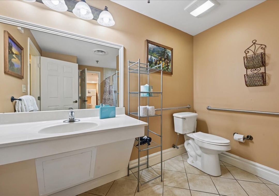 Step into your spacious bathroom with granite counters, organized storage, and thoughtful accessibility features for your comfort.