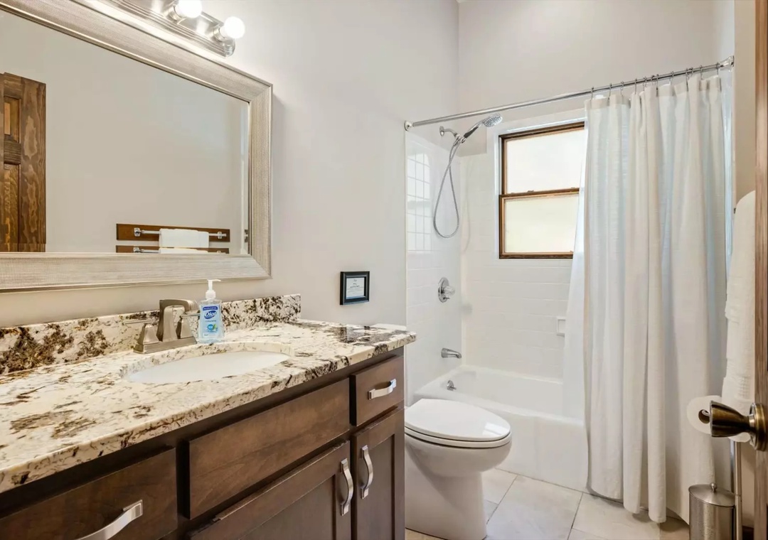 Your private bathroom features granite counters and a relaxing tub-shower combo for unwinding after your adventures.