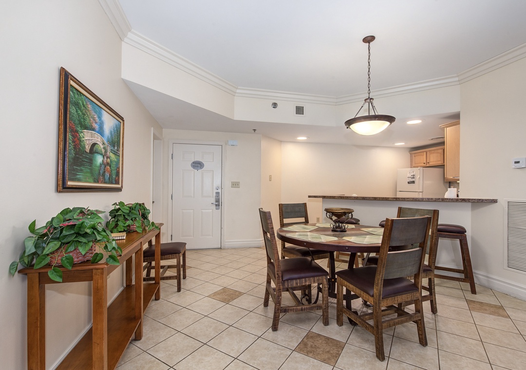 Your elegant dining space welcomes gatherings around the handsome wood table, while the open kitchen invites culinary adventures.