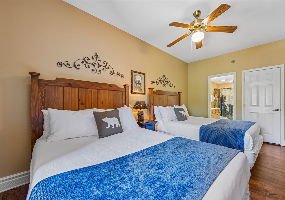 Relax in your cozy twin bedroom with handcrafted wooden headboards and rustic charm that makes you feel right at home.