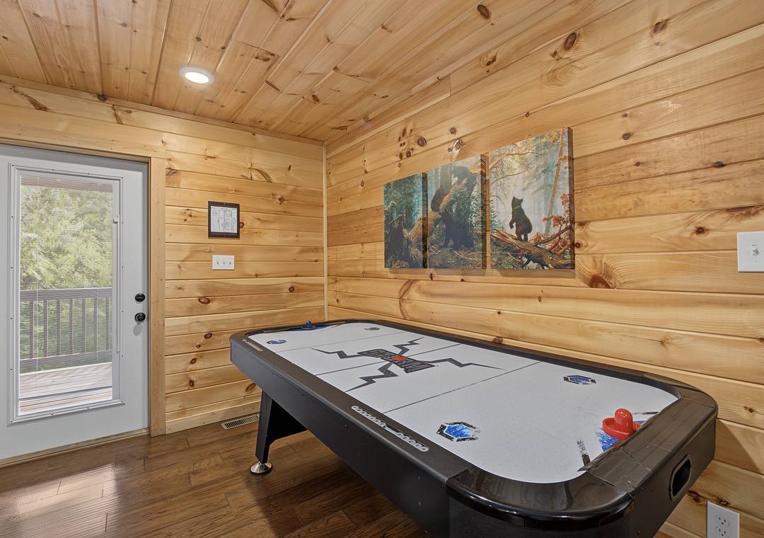 Challenge your travel companions to a friendly game in this rustic-chic space, where natural wood surrounds you and a wildlife-themed triptych adds mountain charm to your vacation fun.