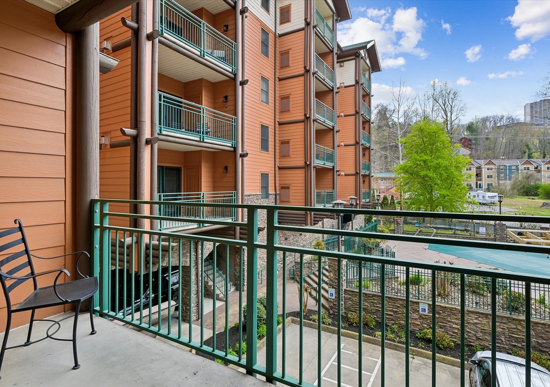 Step onto your private balcony with peaceful pool views, where morning coffee tastes better surrounded by lush greenery and mountain vistas.