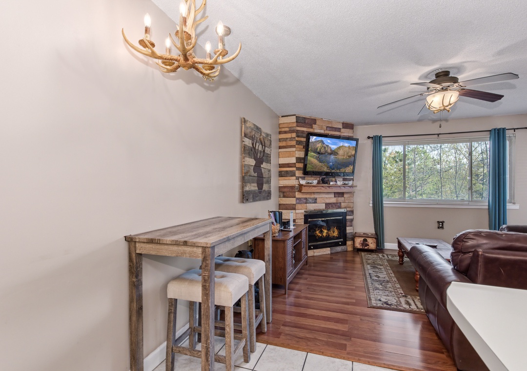 Cozy up by your crackling fireplace while enjoying rustic charm and modern comfort in this inviting living space.