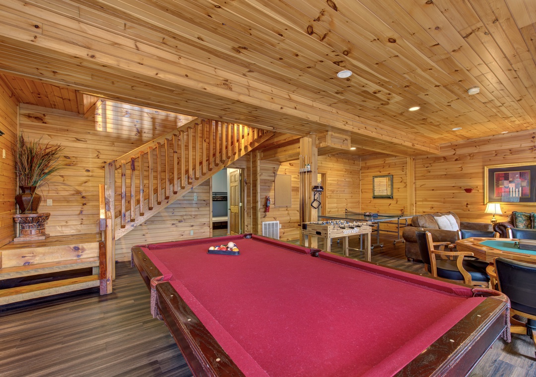 Challenge friends to pool in this cozy game room, where warm wood surrounds you and entertainment awaits around every corner.