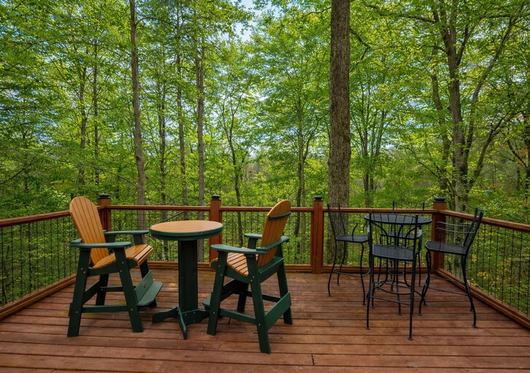 Relax on your private deck surrounded by towering trees, where morning coffee and evening conversations feel perfectly at home in nature's embrace.