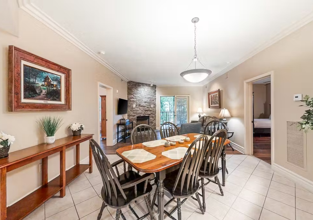 Gather around your elegant dining table for memorable meals with loved ones in this warmly appointed space.