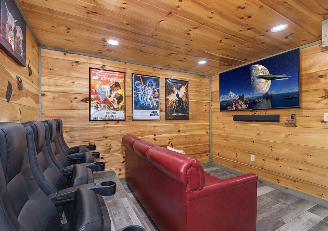 Your private home theater awaits—sink into plush recliners, queue up your favorite films on the big screen, and enjoy movie nights like never before in this cozy cabin retreat.