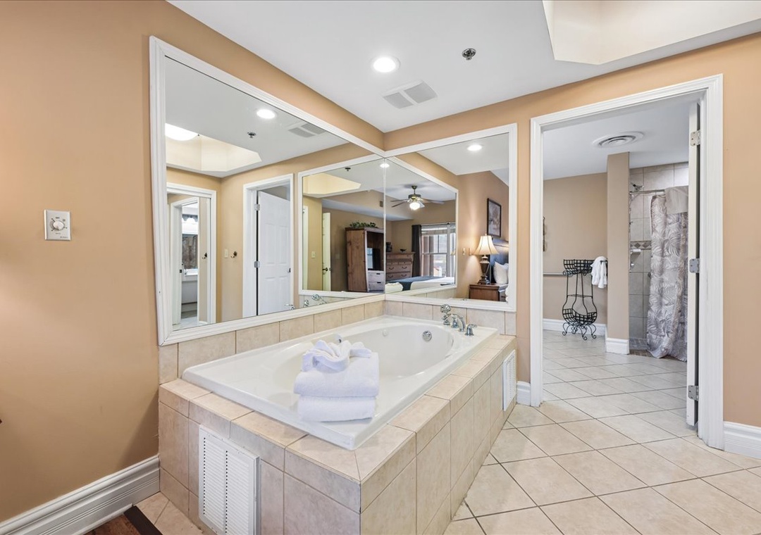 Sink into your private spa-like retreat, where marble surrounds and plush towels create the perfect sanctuary for relaxation.