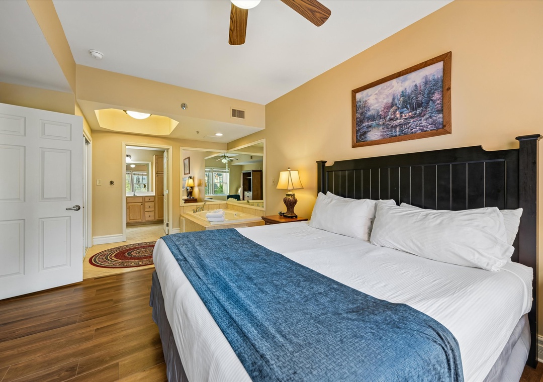 Unwind in your spacious bedroom with rustic charm, featuring a plush king bed and warm wooden accents that create the perfect retreat.