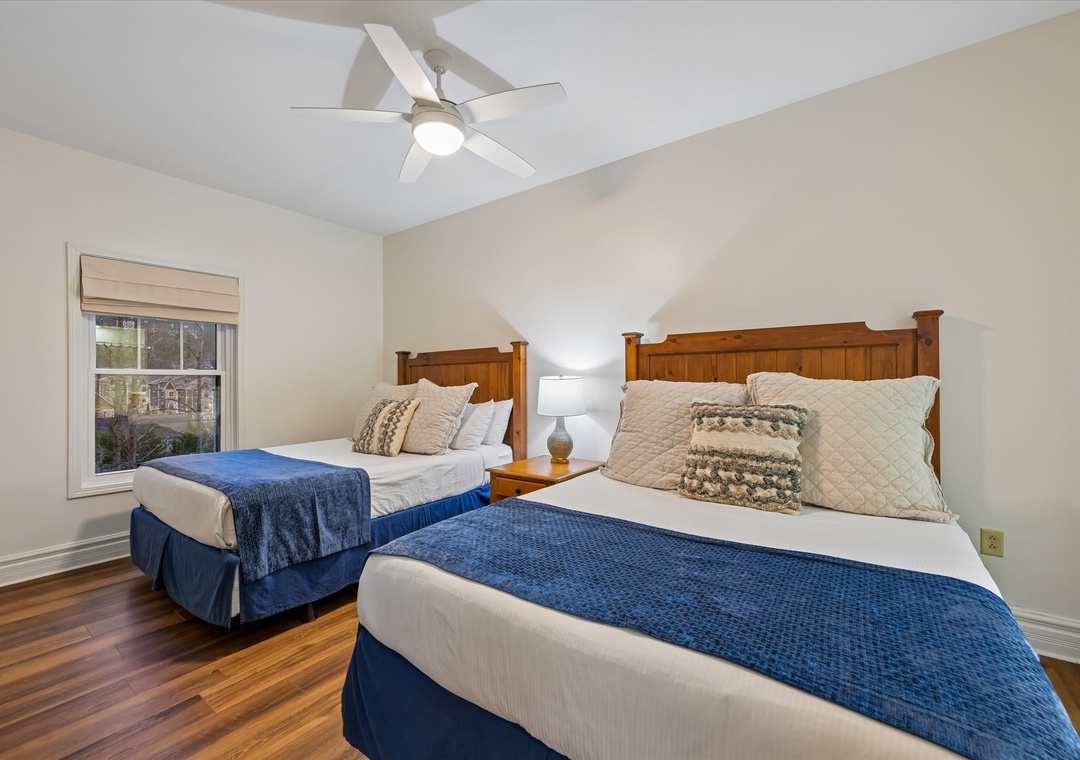 Drift off to peaceful sleep in your comfortable twin beds with crisp linens and warm wood headboards beneath the gentle breeze of the ceiling fan.