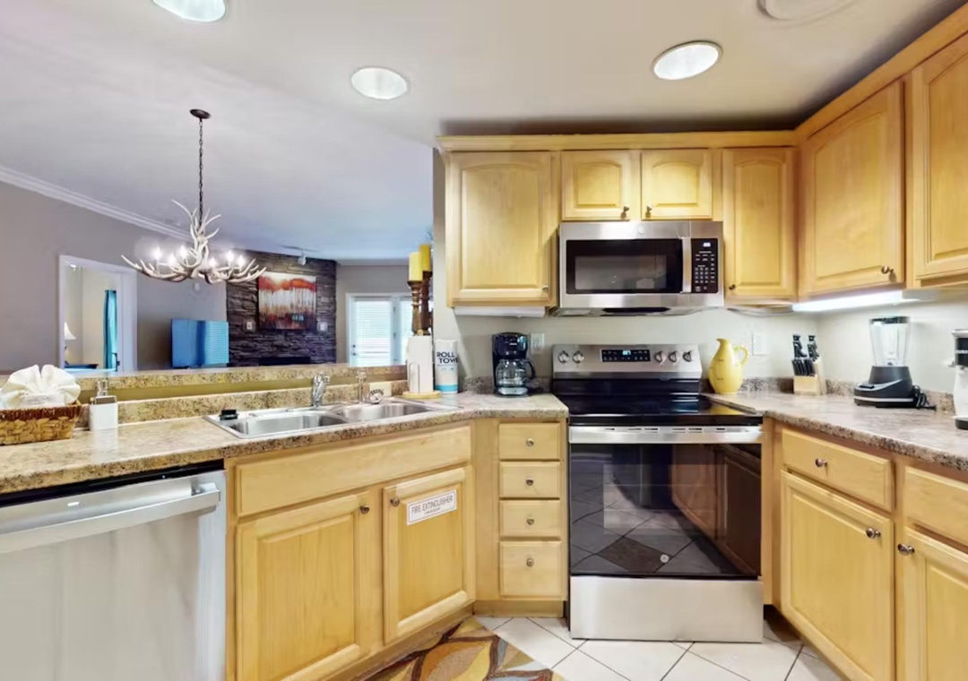 Your fully-equipped kitchen awaits with granite counters, stainless appliances, and everything you need to create memorable vacation meals together.