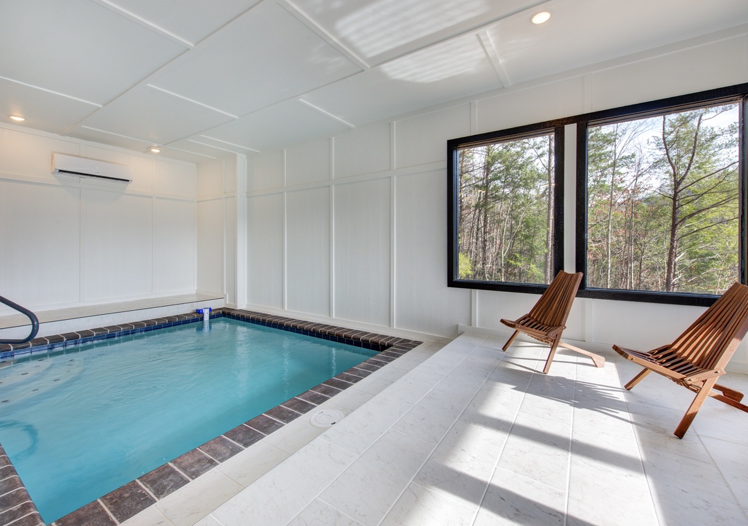 Unwind in your private indoor pool sanctuary, where warm waters and forest views create the perfect escape from everyday life.