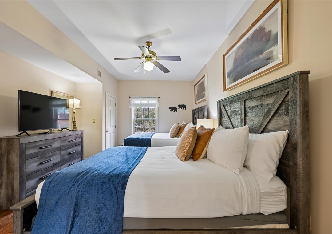 Rest peacefully in your twin beds with rustic charm, soft linens, and modern amenities for a perfect mountain getaway.