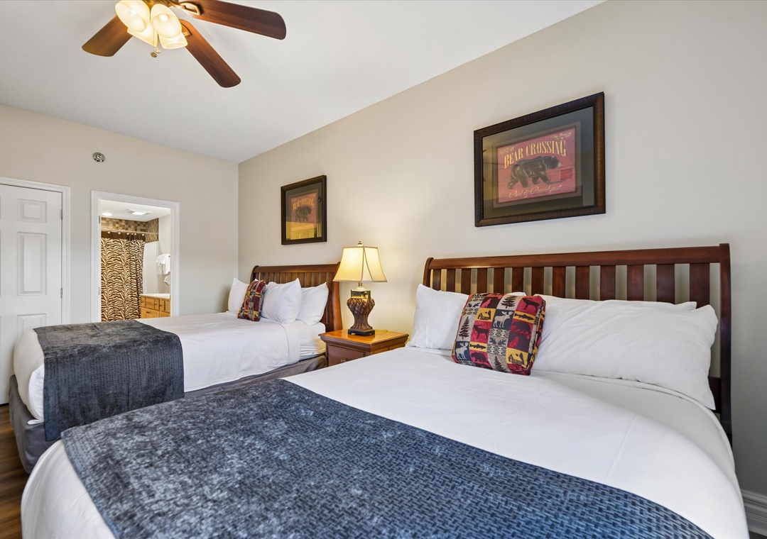Drift off in comfortable twin beds with crisp linens and rustic cabin charm surrounding you.