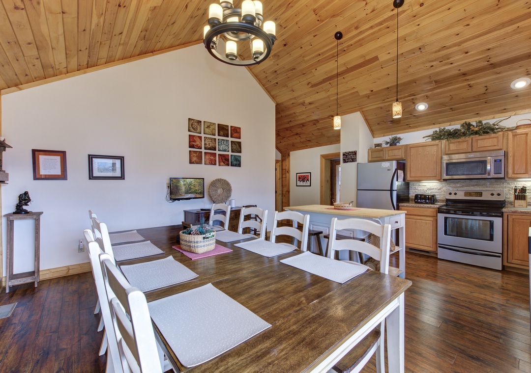Gather around this beautiful dining table where memorable meals and conversations await beneath stunning wood-beamed ceilings.