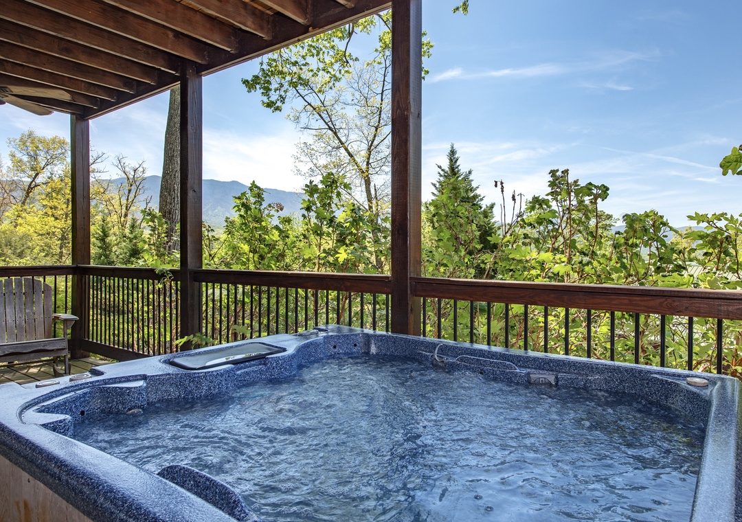 Soak in your private hot tub while gazing at stunning mountain views through lush forest canopy.