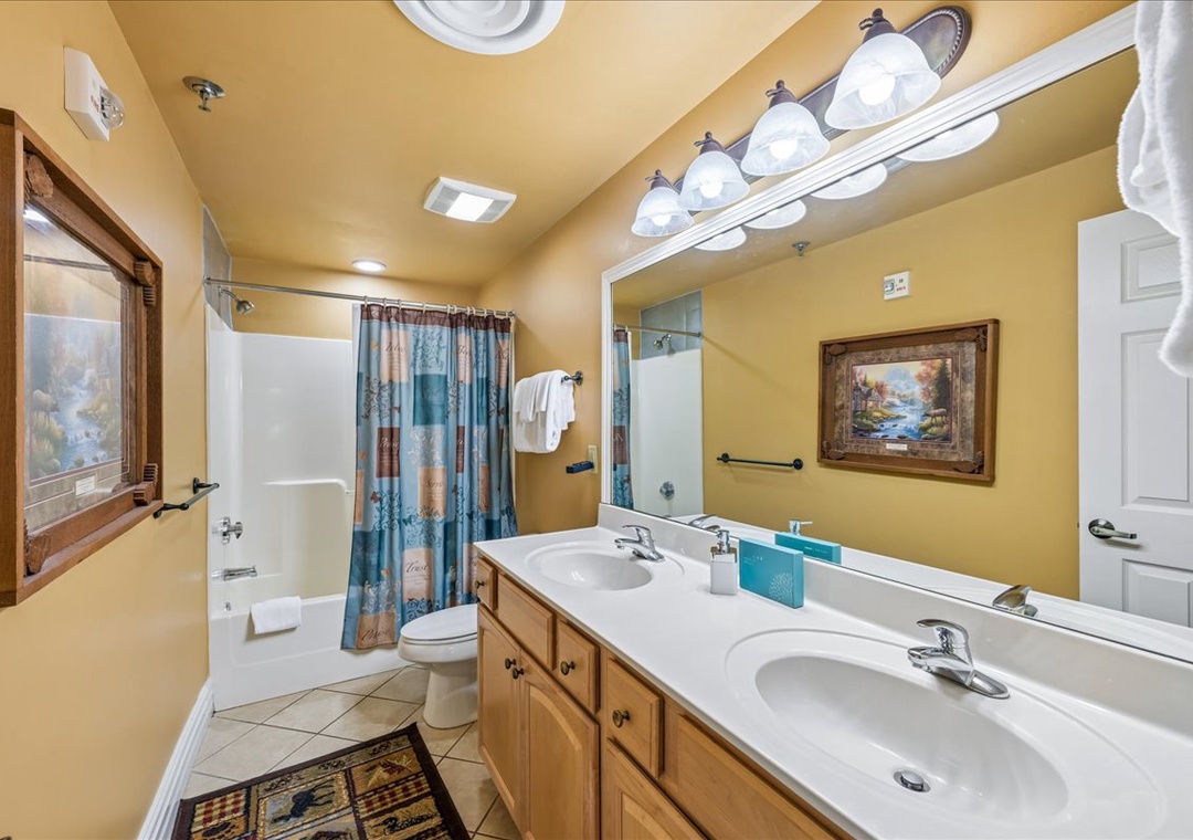 Refresh in your spacious bathroom with double sinks, a relaxing soaking tub, and charming mountain cabin décor that makes you feel at home.