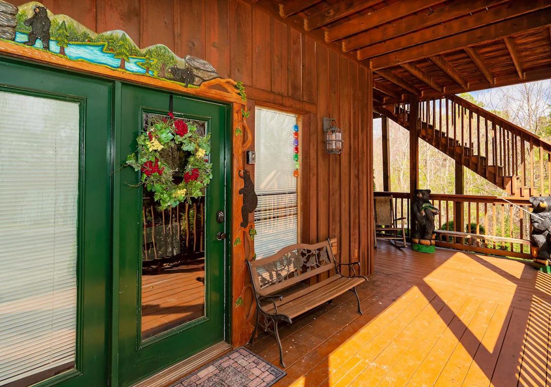 Step onto your private wooden deck where mountain breezes flow through rustic charm, complete with seating to savor peaceful forest views.
