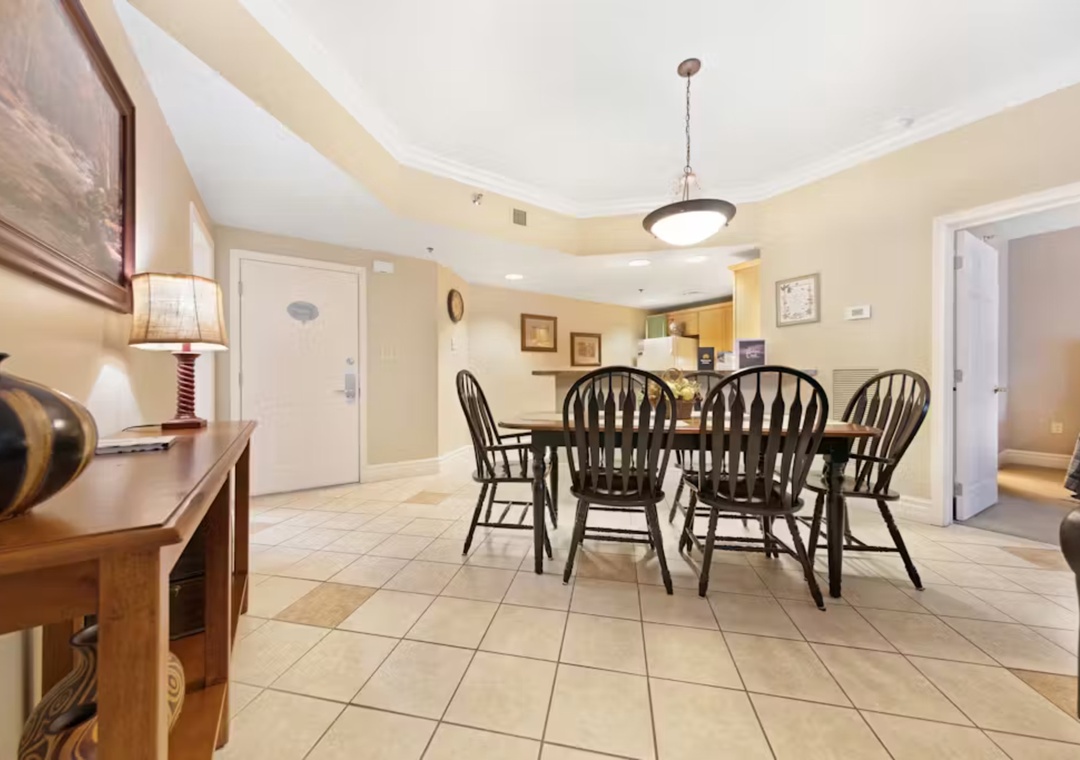 Gather around your spacious dining table where cherished meals and conversations await in this warm, open-concept space.