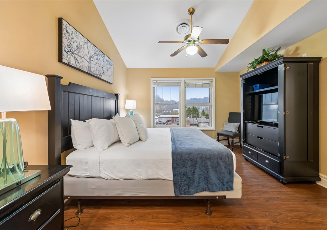 Unwind in your spacious bedroom with plush bedding, mountain views from your window, and modern amenities for ultimate comfort.