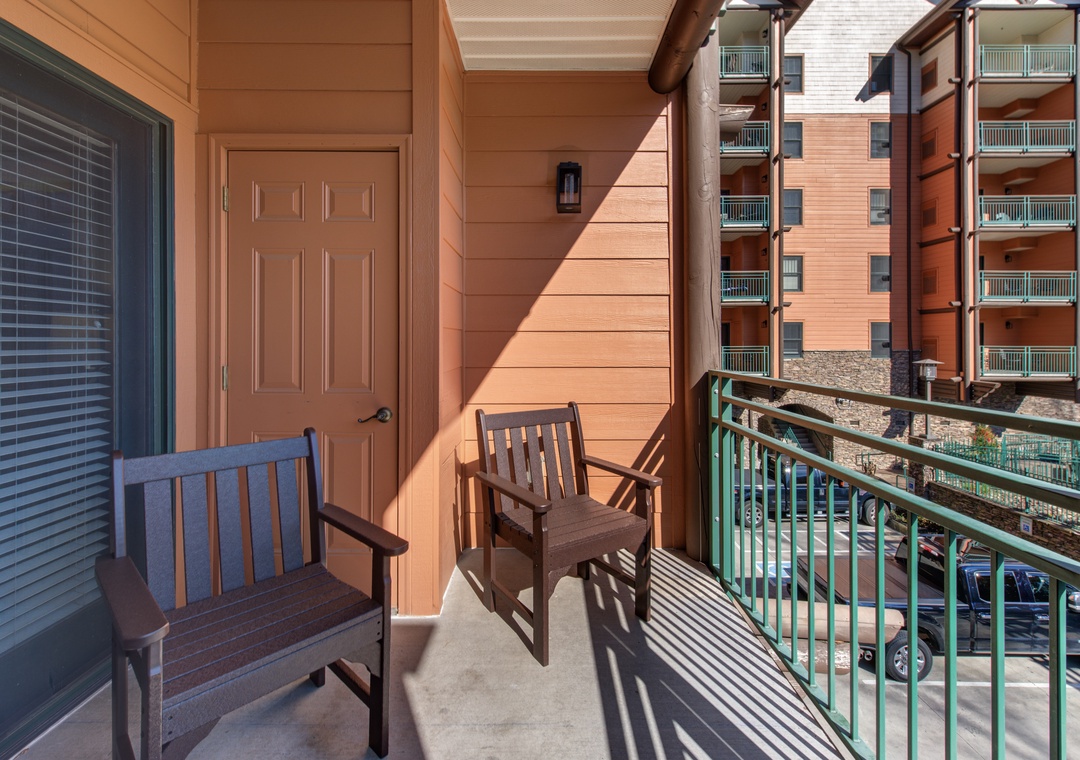 Unwind on your private balcony with morning coffee, watching the world wake up as warm sunlight creates peaceful patterns through the railings.