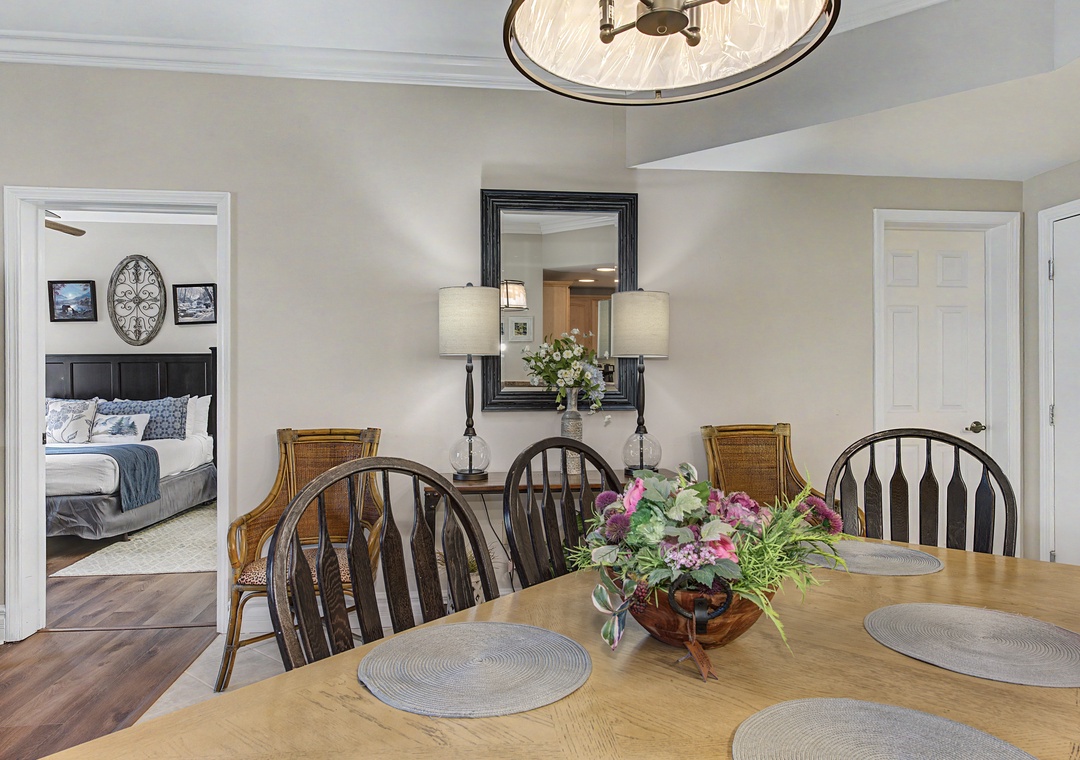 Gather around this inviting dining table where shared meals become cherished memories, with elegant touches creating the perfect atmosphere for your stay.