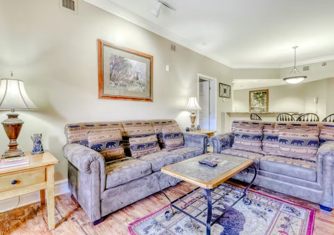 Sink into your cozy sectional surrounded by rustic charm and thoughtful touches that make this space feel like home.