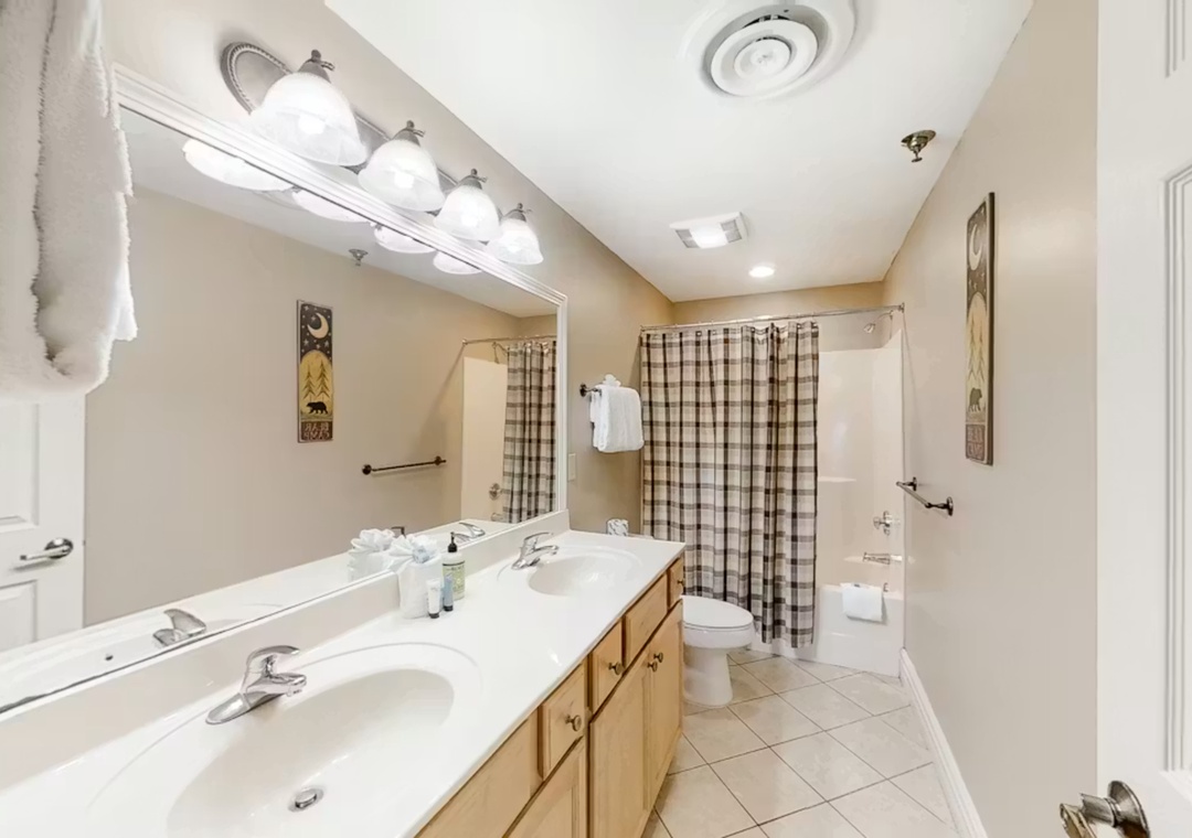 Step into your spacious bathroom with dual vanities, perfect for getting ready together each morning.