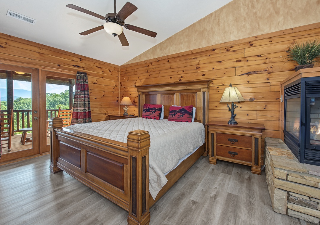 Step into your serene retreat, where natural knotty pine walls and vaulted ceilings create a cozy cabin ambiance. Your private balcony overlooks lush treetops, while the corner fireplace adds warmth and charm to peaceful evenings.