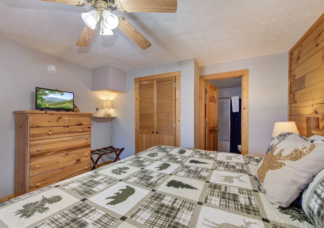 Drift off to sleep in your cozy retreat, where rustic pine furniture and nature-themed bedding create the perfect woodland sanctuary for restful nights.